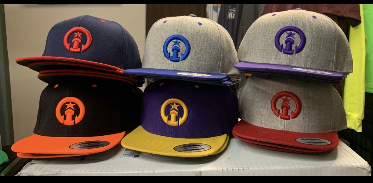 Custom embroidered snapback hats in multiple colorways